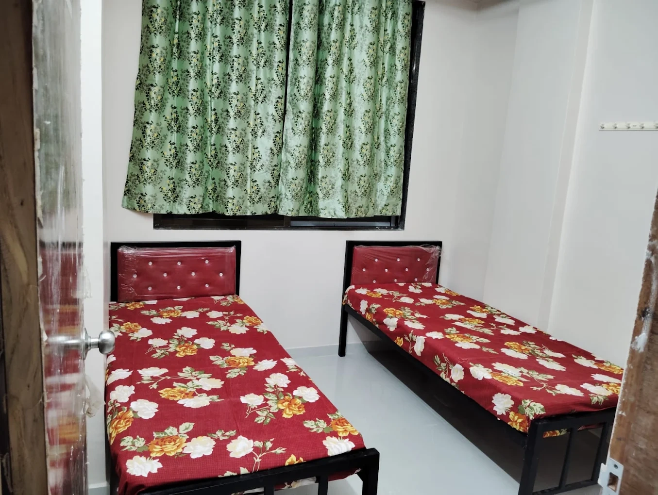 Well-maintained PG room interior near Ghansoli station Navi Mumbai - Atul Paying Guest House